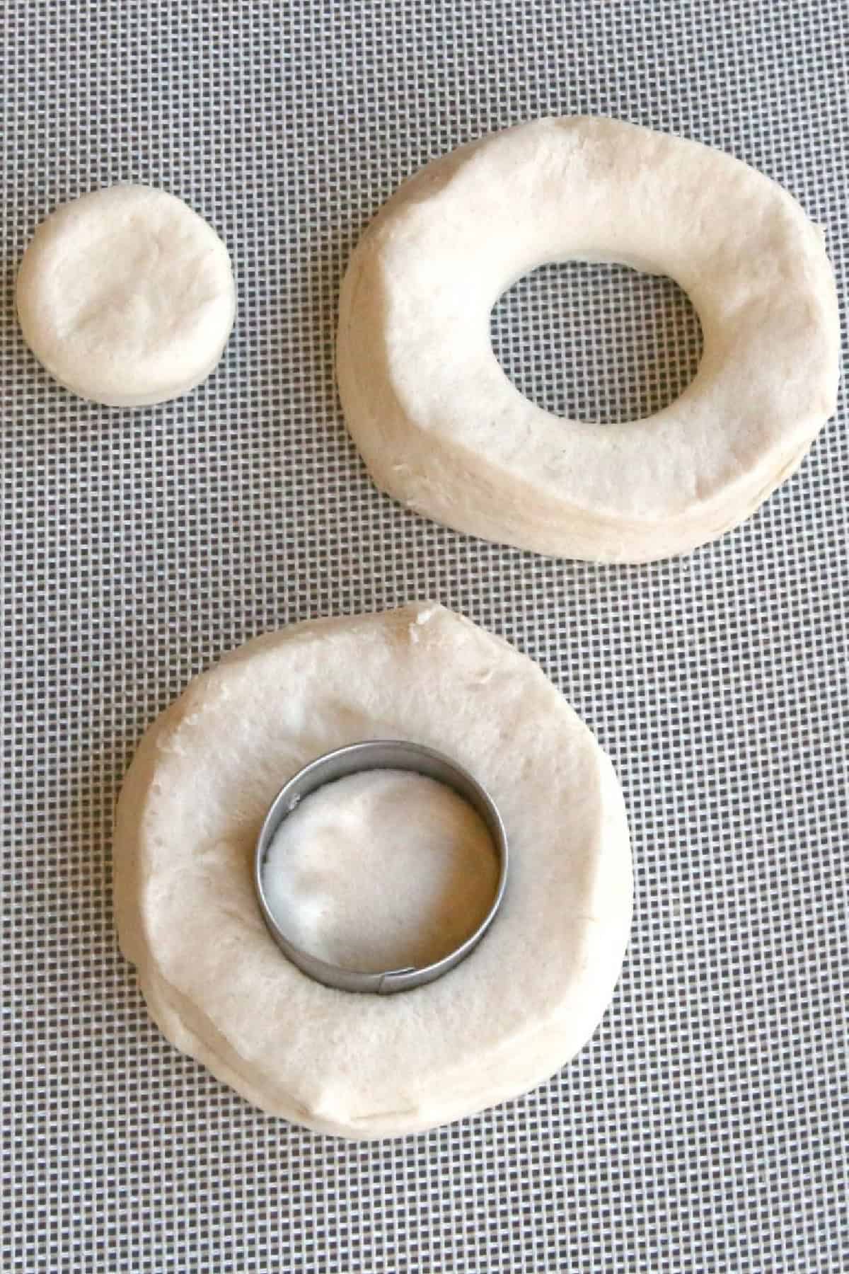 Cutting biscuit dough with a round cookie cutter