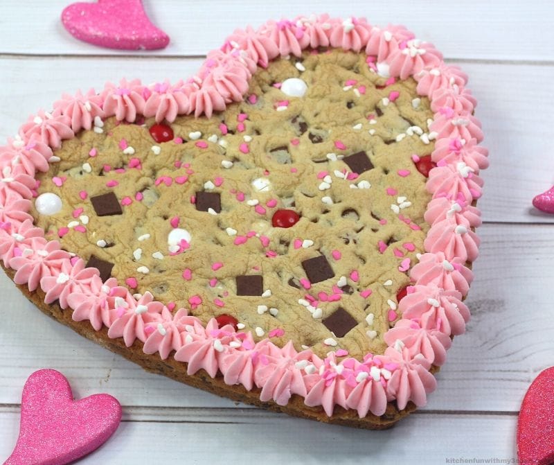 cookie heart cake with candies and sprinkles