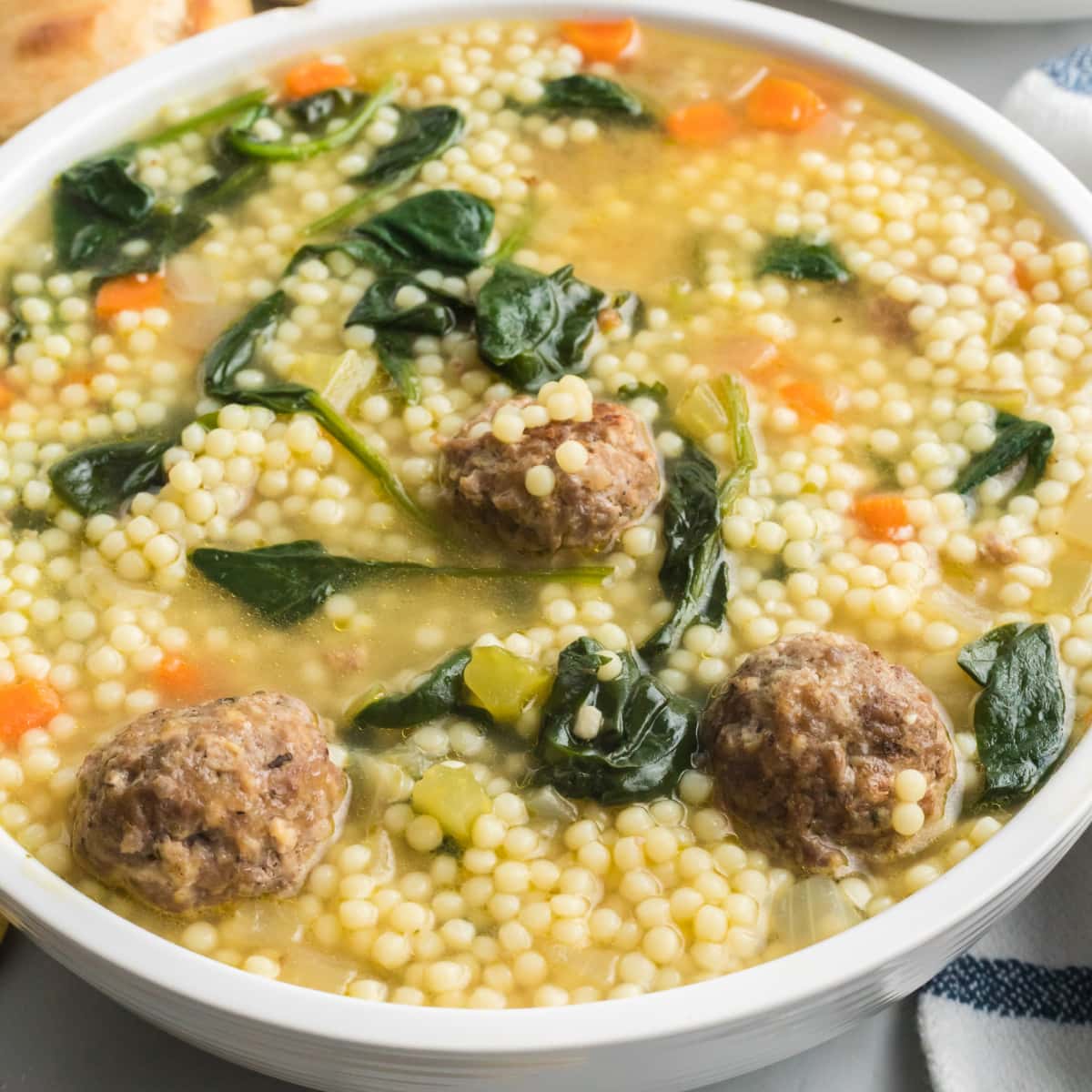 https://kitchenfunwithmy3sons.com/wp-content/uploads/2020/01/italian-wedding-soup-feature.jpg