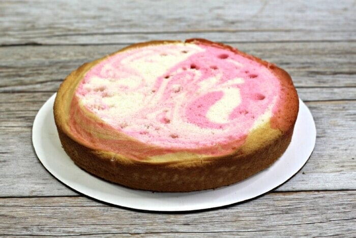 pink and white swirled cake layer