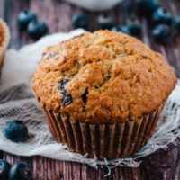Blueberry Oatmeal Muffins with a white cloth