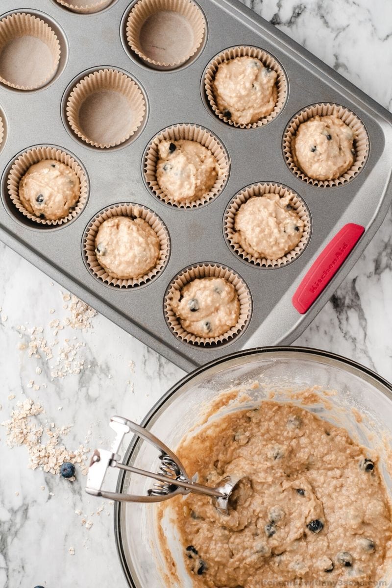 Blueberry Oatmeal Muffins batter in a muffin tin