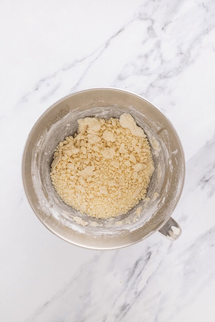 Browned butter, cream cheese, and powdered sugar in a bowl