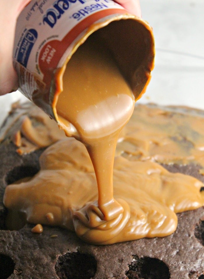 Caramel Evaporated Milk being poured over Chocolate Cake