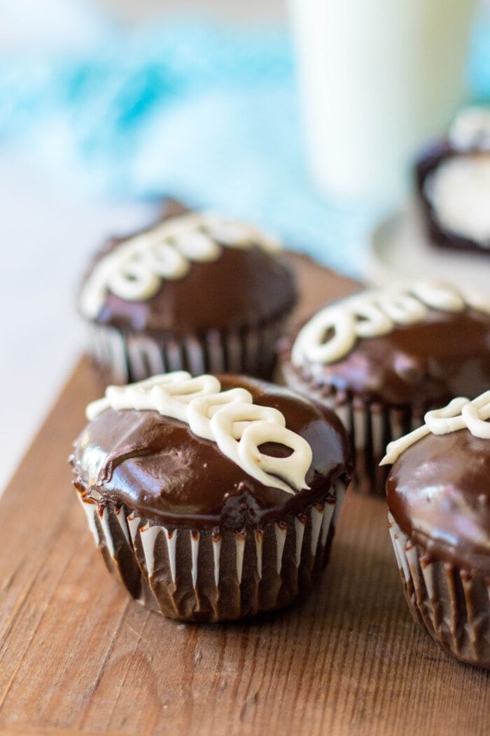 Hostess Cupcakes on a wooden board.
