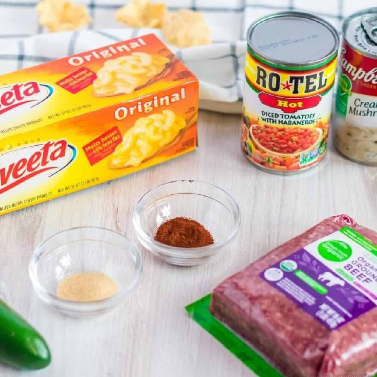 Velveeta cheese, Rotel, and ground beef come together in this cheesy and flavorful Hamburger Dip. Made in the slow cooker! Ingredients needed to make hamburger dip