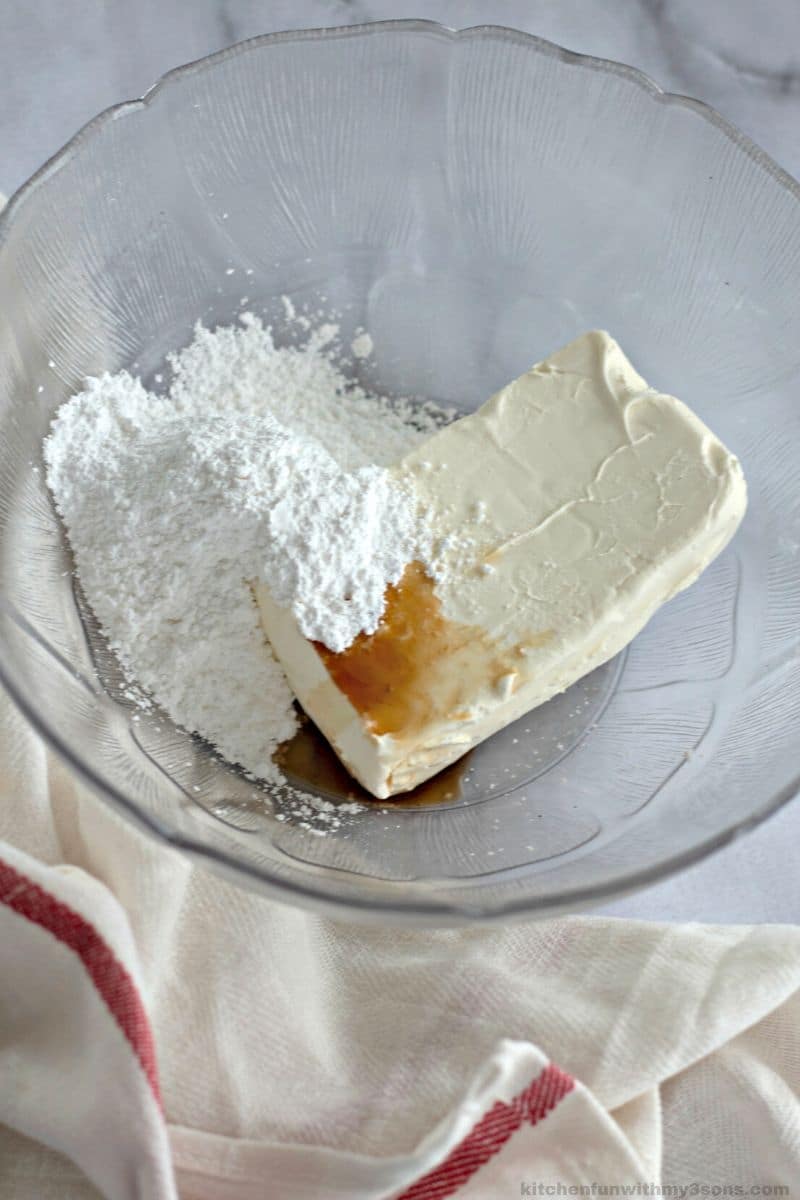 cream cheese and powdered sugar in a bowl