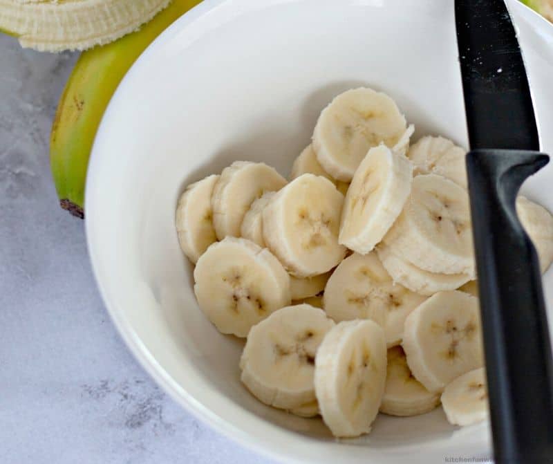 cut bananas in a white bowl
