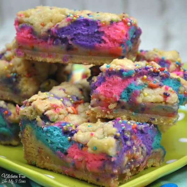 Unicorn cheesecake bars with sugar cookie crust.