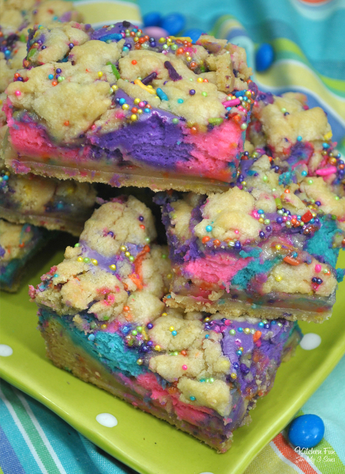 Unicorn Cheesecake Bars with a soft sugar cookie crust and colorful cheesecake is a delicious dessert and perfect for a unicorn birthday party. 