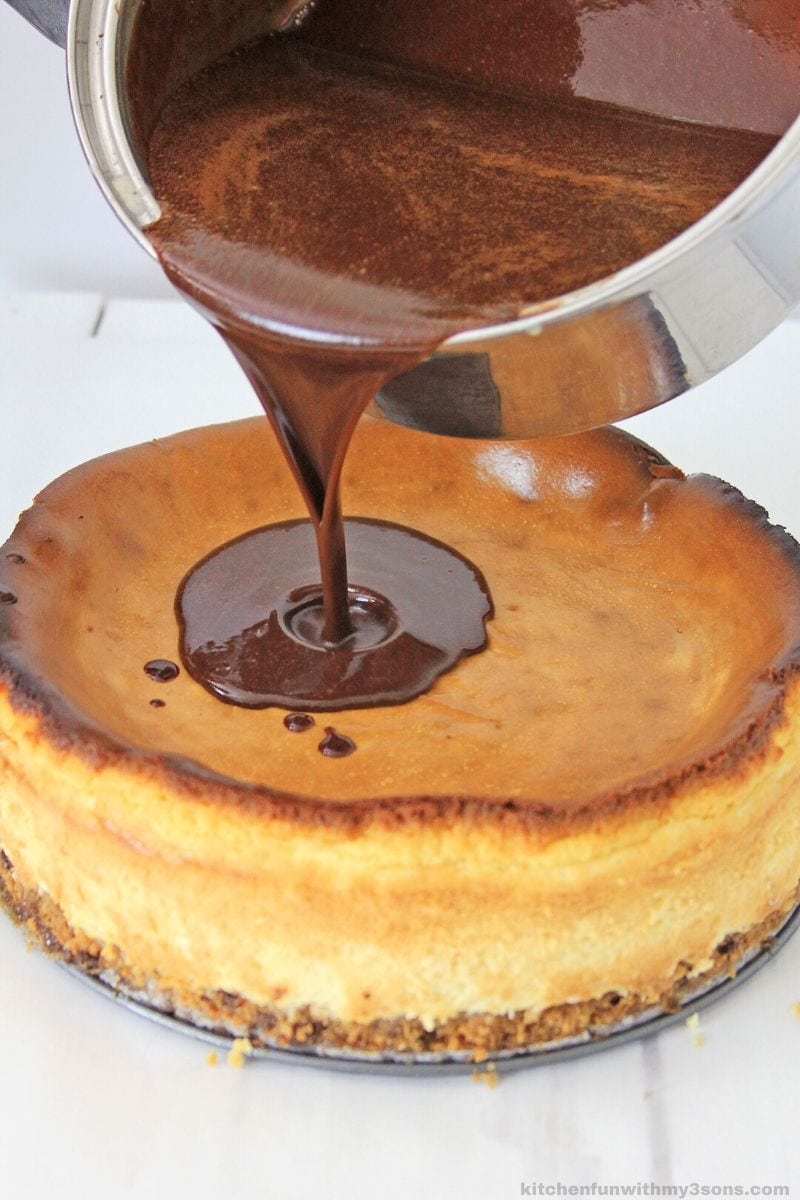 chocolate pouring over chocolate chip cookie dough cheesecake