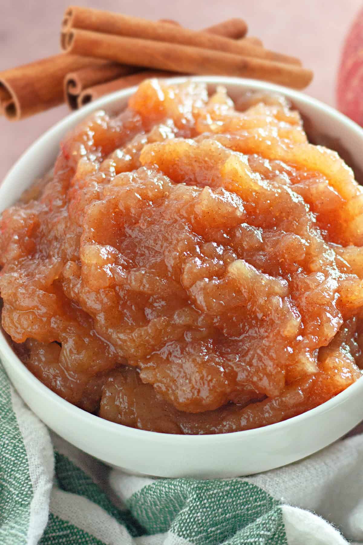 This Homemade Cinnamon Applesauce is a simple, delicious recipe that’s perfect for any time of year! Made with naturally sweet apples that intensify in flavor as they cook down, this easy applesauce pairs beautifully with warm, aromatic cinnamon. Homemade cinnamon applesauce in a bowl