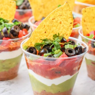 7 Layer Dip Cups are the best appetizer to serve at your next party. This recipe is perfect for Mexican dinner night and goes perfect with tacos and burritos.
