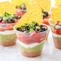7 Layer Dip Cups are the best appetizer to serve at your next party. This recipe is perfect for Mexican dinner night and goes perfect with tacos and burritos.