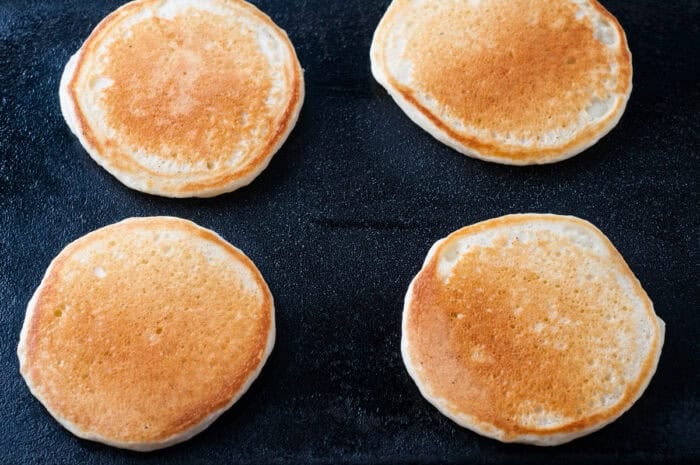 Browned pancakes on a griddle