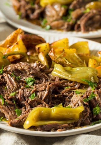 Mississippi Pot Roast on a plate with peppers.