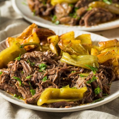Mississippi Pot Roast on a plate with peppers.