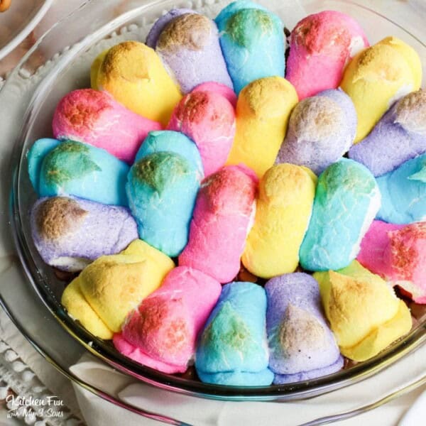 Peep s'mores dip in a round glass baking dish.