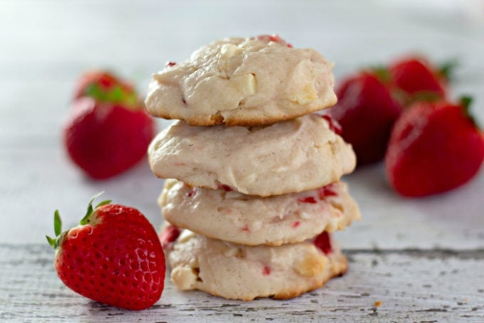 Stacked Strawberry White Chocolate Chunk Cookies on a rustic white table