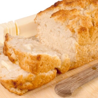 A loaf of beer bread with two slices