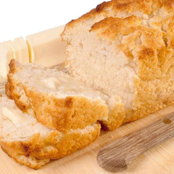 A loaf of beer bread with two slices
