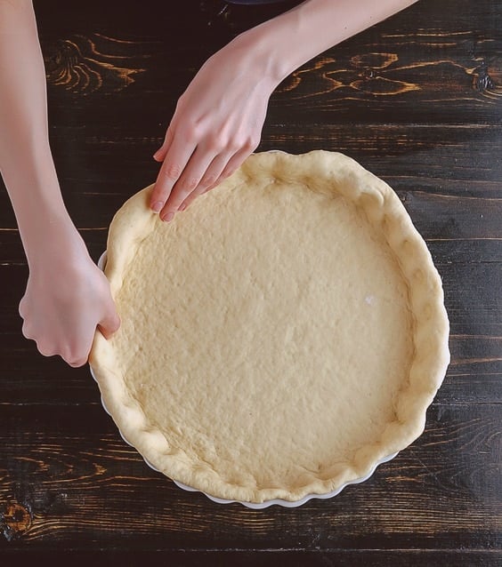 Pressing Pie Dough in a Baking Dish