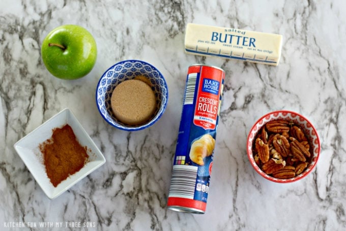 ingredients to make Apple Pie Bites on a marble counter