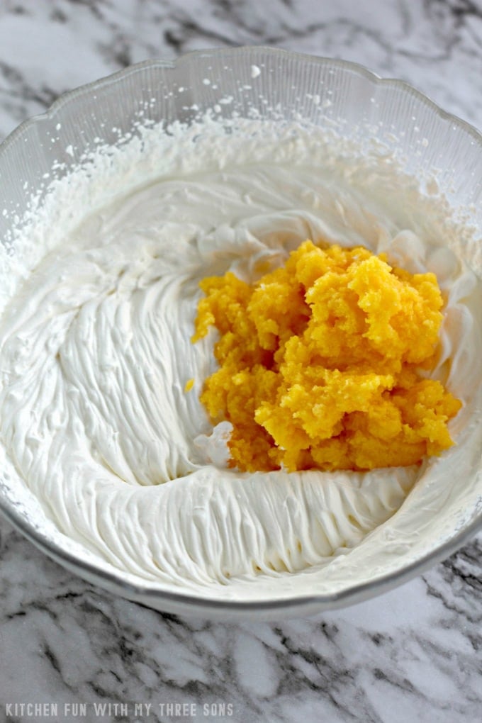 mixing whipped cream and vanilla pudding together to make pastry cream