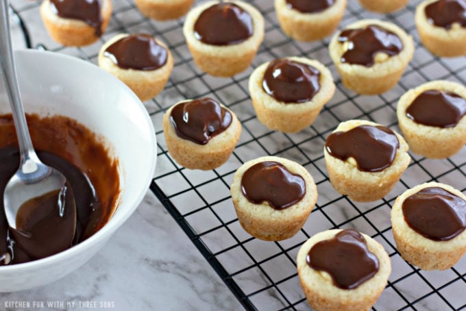 Topping Boston Cream Pie Cookie Cups with homemade chocolate ganache
