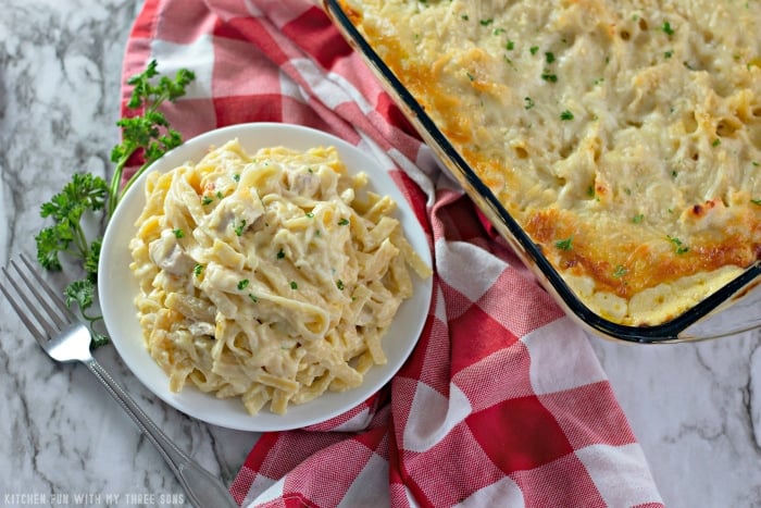Chicken Tetrazzini served in a bowl next to a casserole dish.