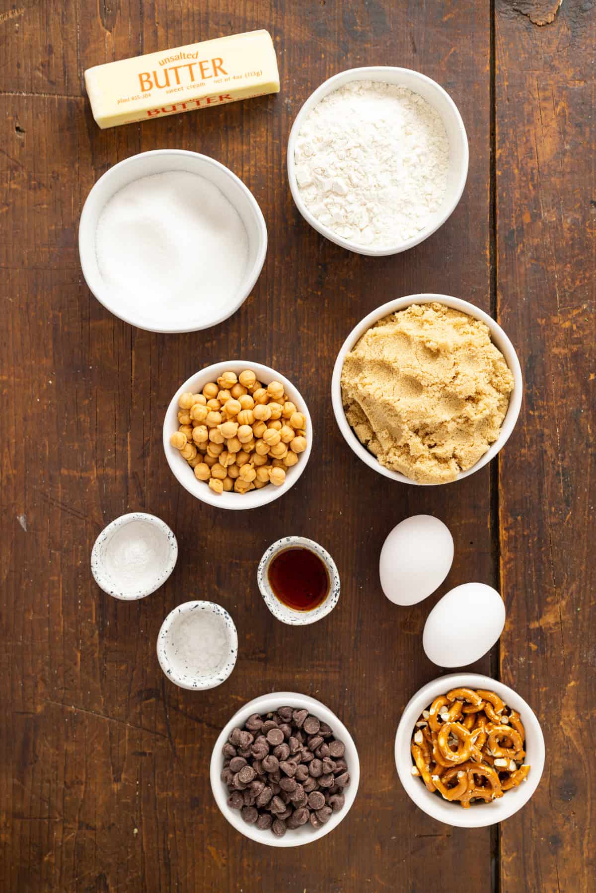 Made with brown butter, pretzels, caramel bits, and chocolate chips, Kitchen Sink Cookies are the perfect combination of sweet and salty. Overhead view of ingredients needed to make kitchen sink cookies