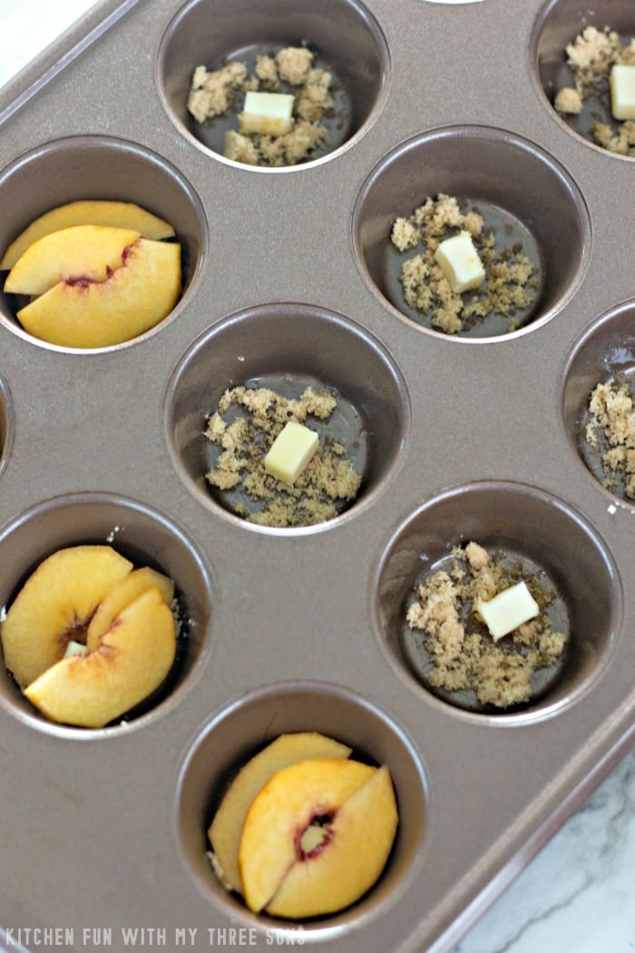 Brown sugar, butter and peaches inside of a standard 12-count muffin tin