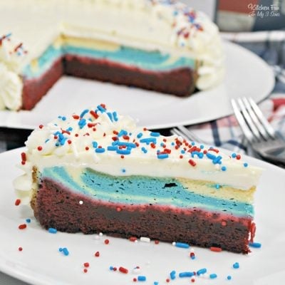Patriotic Cheesecake Recipe is a yummy dessert for Memorial Day and the 4th of July. This is layered with red velvet cake, cheesecake and homemade frosting.