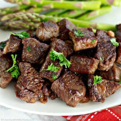 Garlic Butter Steak Bites with asparagus on the side.