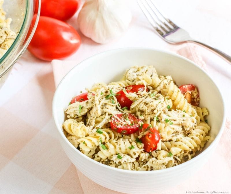 Chicken Pesto Pasta with Tomatoes in a white bowl