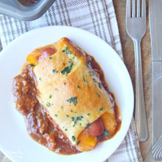 Chili Cheese Dog Bake is a quick kid-friendly meal for the family. Everyone loves these fun hotdogs with cheese wrapped in pizza dough.