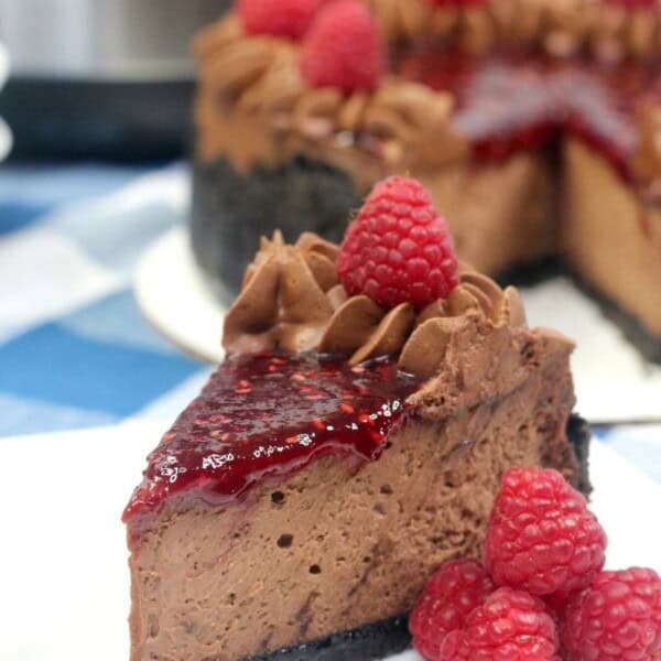 chocolate raspberry cheesecake on a white plate