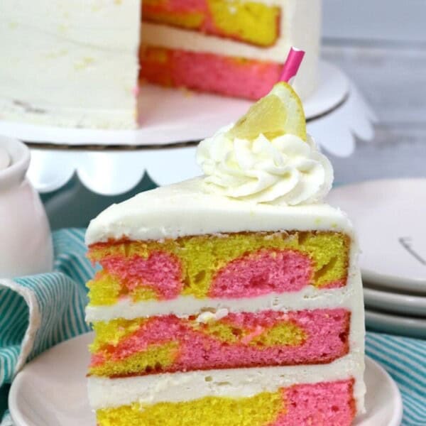 yellow and pink cake on a white plate