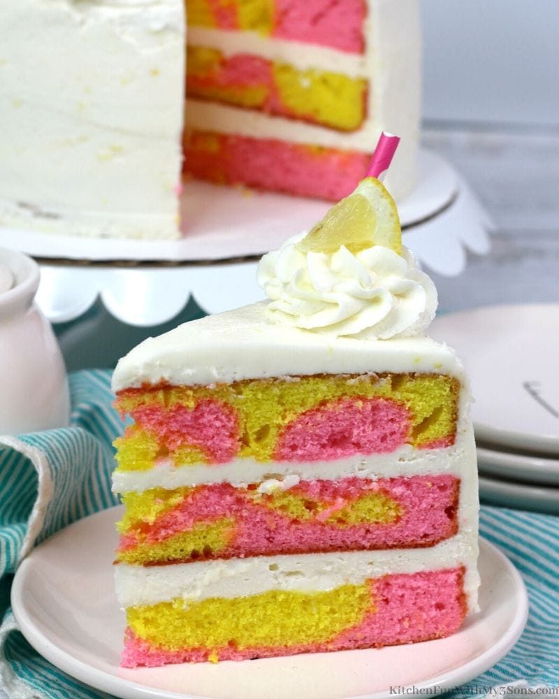 yellow and pink cake on a white plate