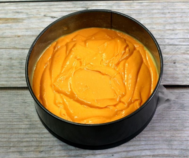 orange cake batter in pan