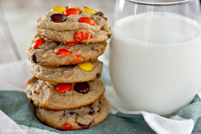 Reese's Pieces Peanut Butter Cookies with milk on a green and white towel