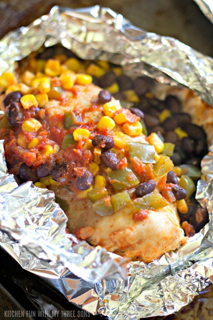 corn, black beans and peppers on top of chicken