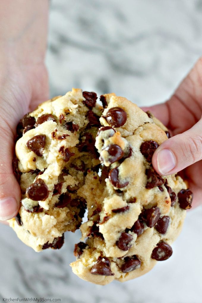 Breaking apart Thick Chocolate Chip Cookies showing the iside