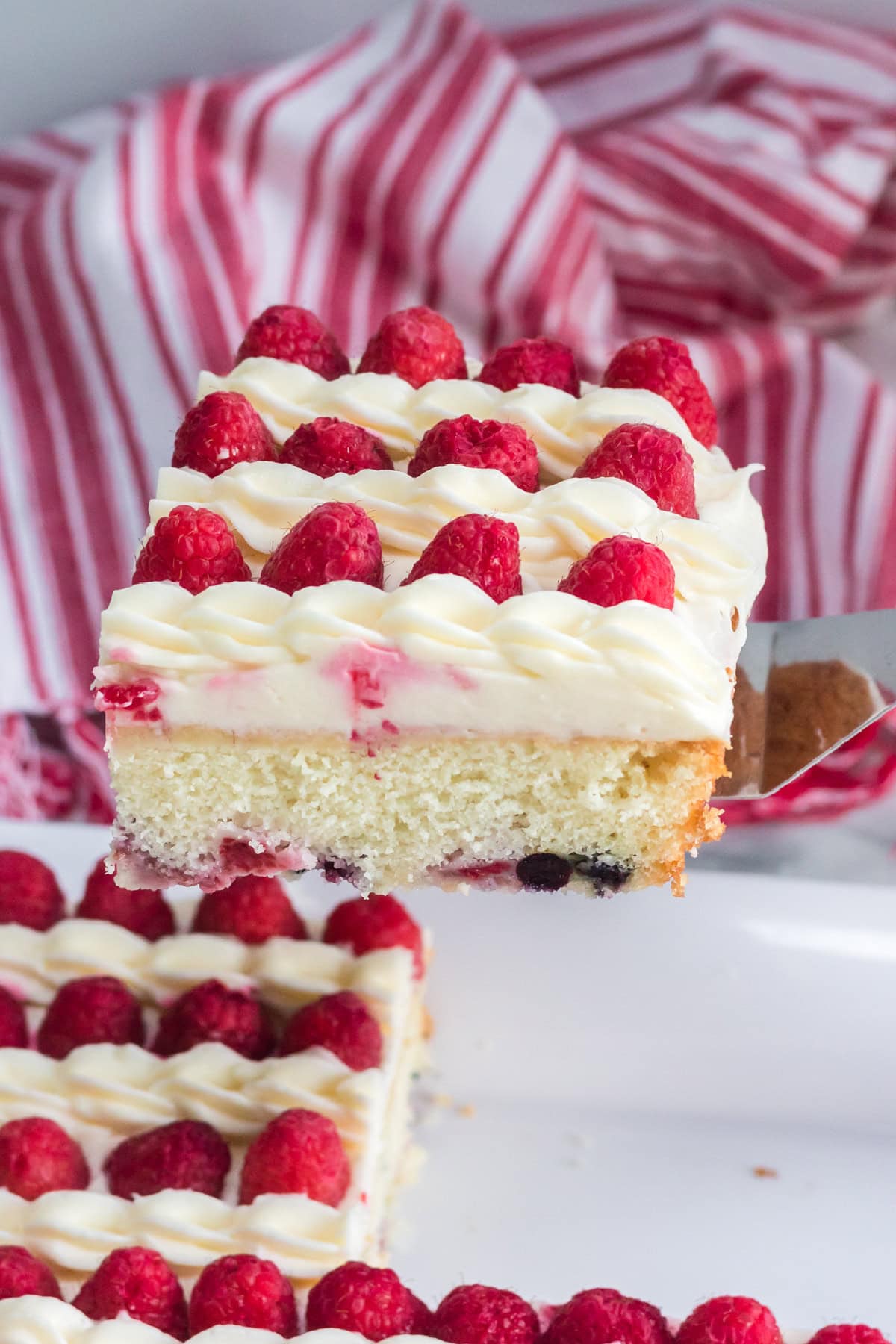 This American Flag Cake Recipe is easy to make and perfect for Memorial Day or 4th of July. slice of American Flag Cake
