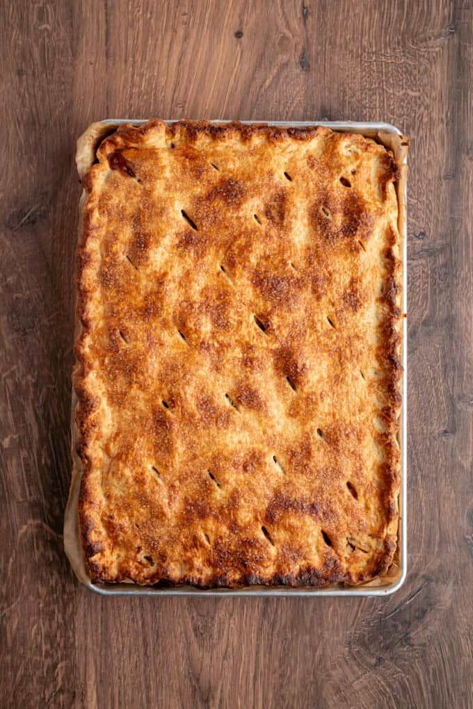 With a flaky, buttery crust and perfectly spiced apple filling baked in a jelly roll pan, Apple Slab Pie is ideal for holidays and gatherings. A baked apple slab pie
