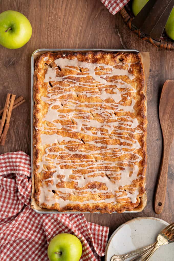 With a flaky, buttery crust and perfectly spiced apple filling baked in a jelly roll pan, Apple Slab Pie is ideal for holidays and gatherings. Glaze drizzled over apple slab pie