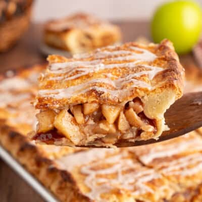 Serving a slice of apple slab pie