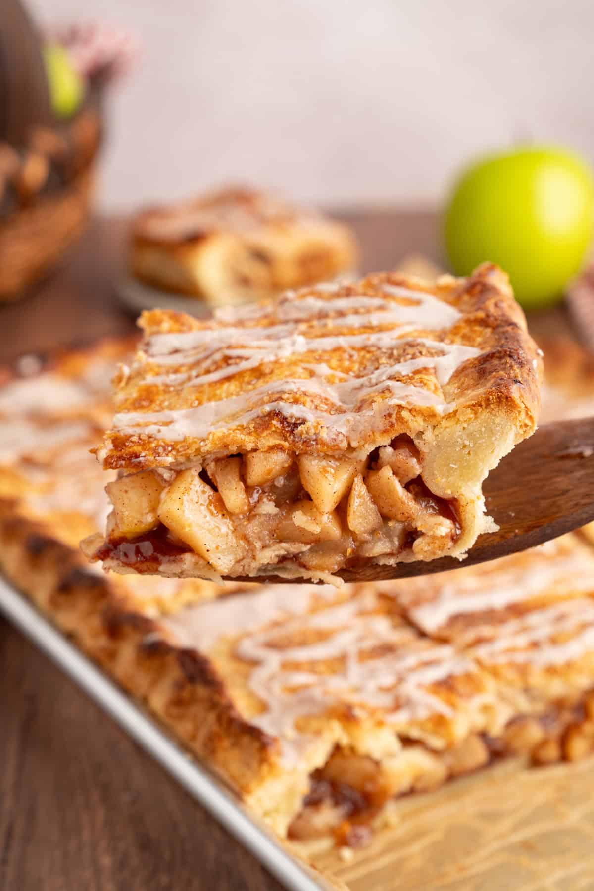 With a flaky, buttery crust and perfectly spiced apple filling baked in a jelly roll pan, Apple Slab Pie is ideal for holidays and gatherings. Serving a slice of apple slab pie