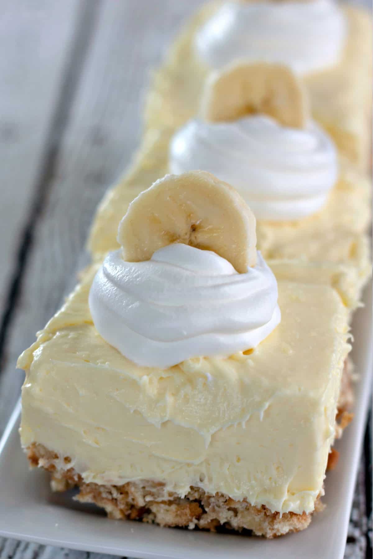 Banana Cream Cheesecake Bars on a serving platter.