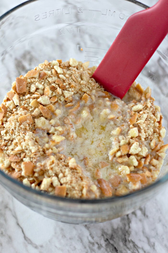mixing the vanilla wafer crumbs with melted butter